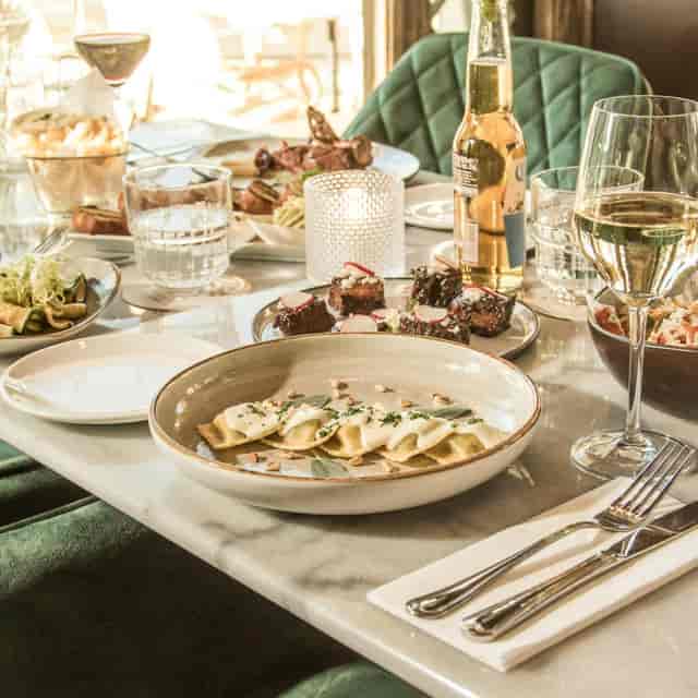 Upscale JOYA banquet dining with artisanal plating for corporate dinner and networking events.