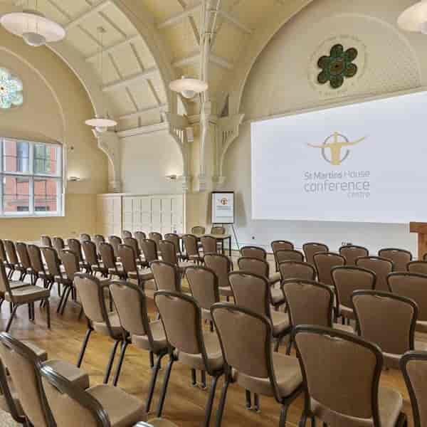 Memon Association Leicester event venue: theater-style corporate presentation seminar hall.