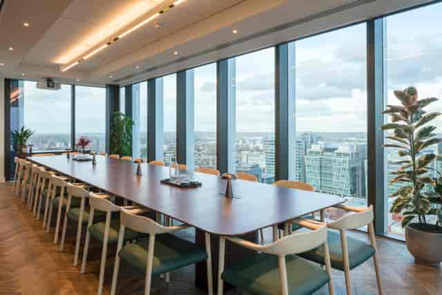 Modern boardroom with city view for luxury business meetings and corporate events.