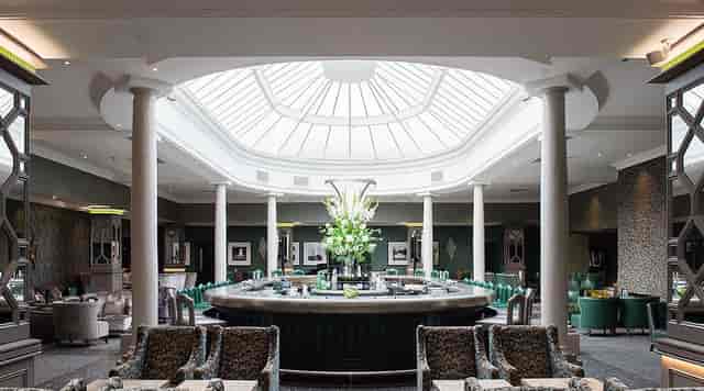 Sophisticated bar venue with floral decor, perfect for corporate events and social gatherings.