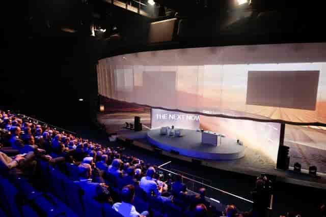 Showpalast München stage with curved panoramic screen for keynote presentations and business events.