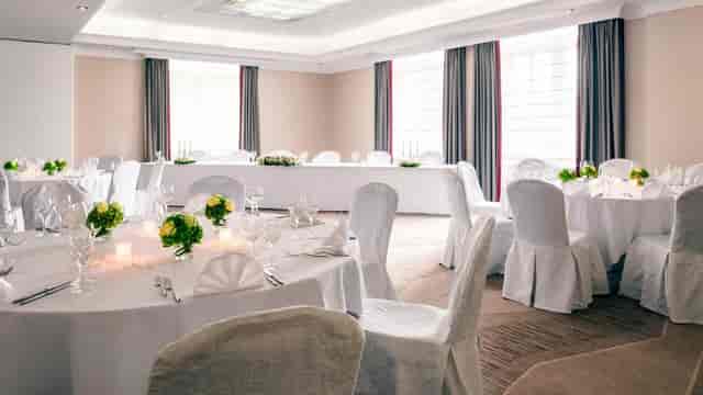 Banquet-style meeting room at Munich Marriott Hotel for weddings and corporate luncheons.