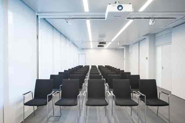 Modern theater-style event room for professional seminars and presentations.