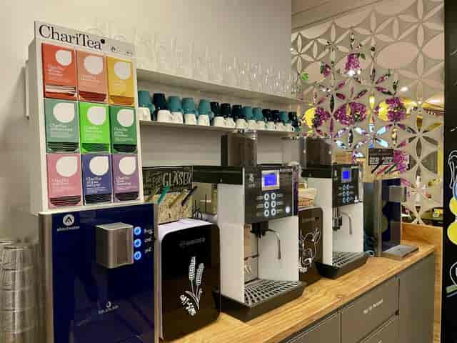 Self-service refreshment station with coffee and tea at Alpspitze conference venue.