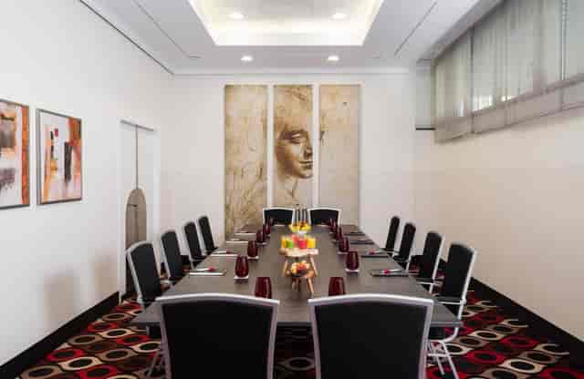 Upscale boardroom at Leonardo Hotel Munich for professional corporate meetings and executive events.