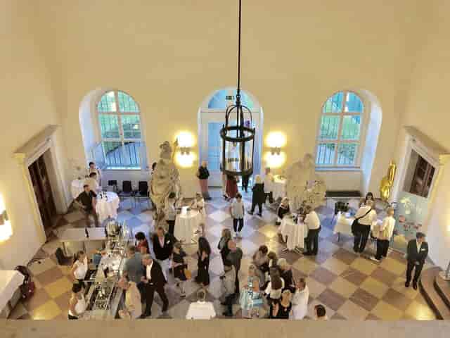 Orangeriesaal networking reception with historic architecture for corporate events.