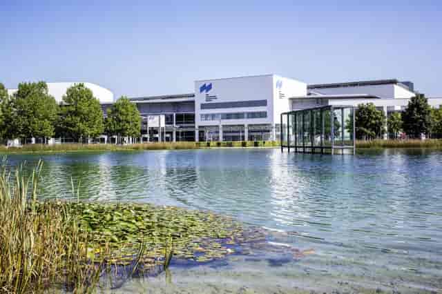 ICM Munich convention center with outdoor networking space for business conferences and events.