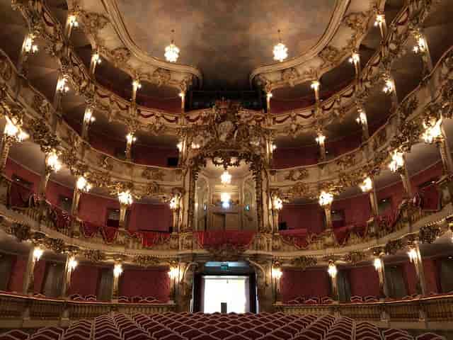 Ornate Cuvilliés-Theater plenary venue with tiered architecture for corporate events and conferences.
