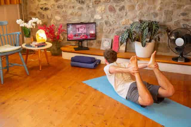 Yoga studio at Schlosspalais with curated decor for hybrid wellness and virtual fitness sessions.