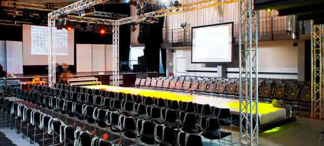 TonHalle industrial venue with central runway stage for fashion shows and corporate events.