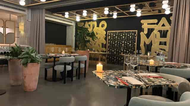 Modern restaurant dining space with terrazzo tables for upscale networking and private events.