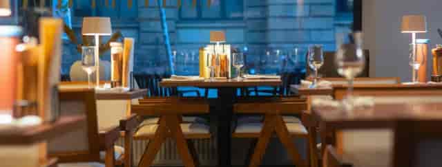 Upscale restaurant event space with mid-century decor for VIP dinners and networking.