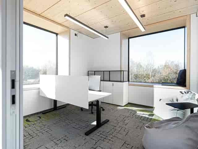 Modern huddle room with ergonomic seating for professional team meetings and collaborative work.