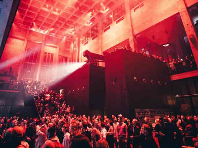 Bergson Kunstkraftwerk atrium with red lighting for industrial-chic events and conferences.