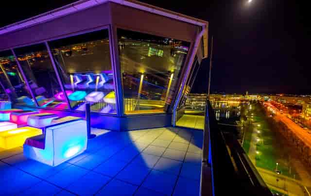 Watchtower rooftop venue with modern lounge furniture for corporate mixers and networking events.
