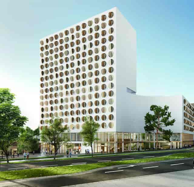 Modern hotel exterior at Revo Munich, ideal for corporate events and tech conferences.