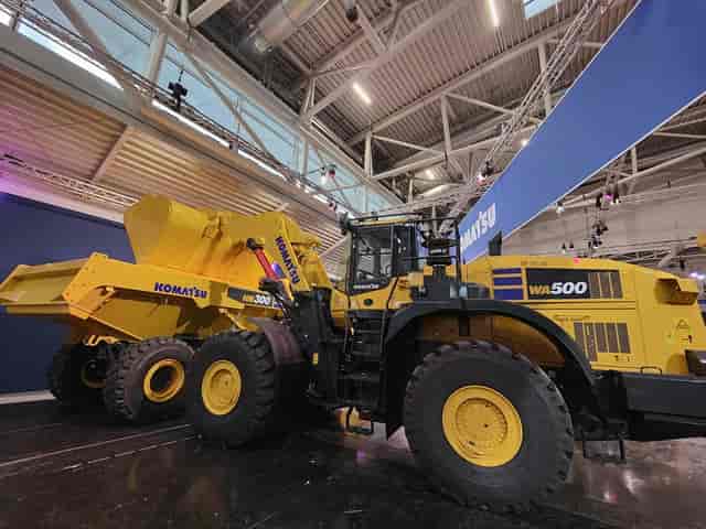MEO 04 trade show booth with heavy machinery for event installation and exhibition logistics.