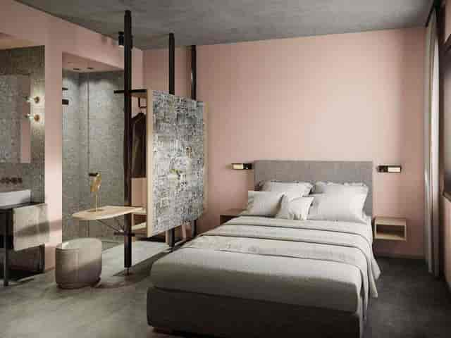 Modern boutique hotel room at MIANO Hotel München for business travel.