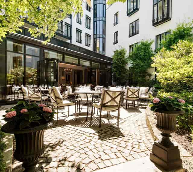 Palace Wintergarten Munich: High-end outdoor patio for executive luncheons and networking events.