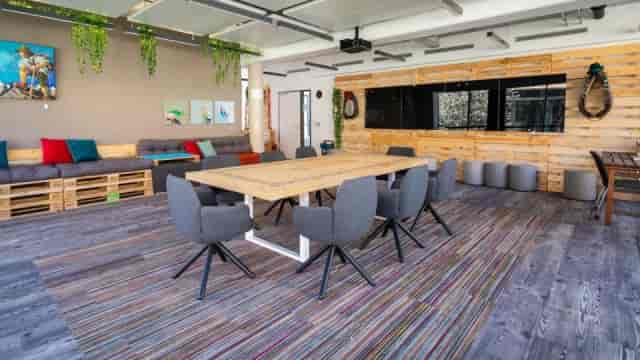 Berghain breakout space with modular pallet seating for collaborative workshops and events.