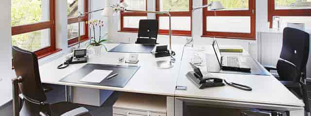 Agendis Business Center conference room featuring traditional office layout for business meetings.