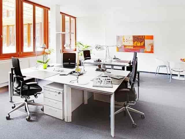 Modern meeting room with cluster seating for collaborative team building and workshops.
