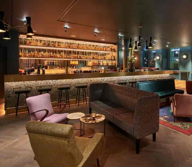 Luxury boutique lounge with bar for executive networking and corporate receptions.