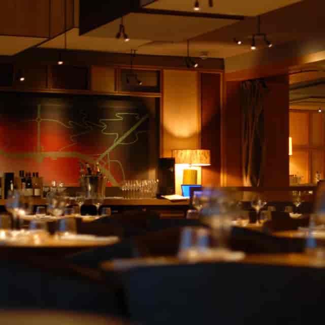 Upscale Louis Grillroom banquet space with warm lighting for professional networking and dinners.