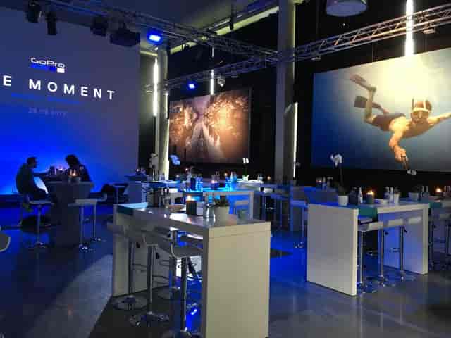 Experiential branding setup at Studio Balan seminary with projection lighting for networking events.