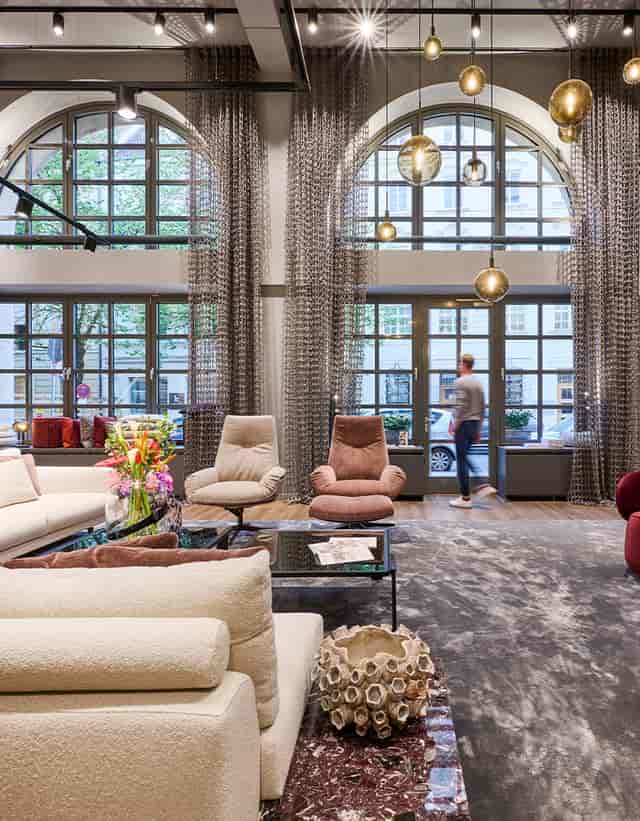 Modern hotel lounge showroom for VIP networking and corporate event venue.