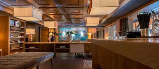 Sophisticated LOUIS Grillroom lounge with warm wood decor for executive networking and receptions.