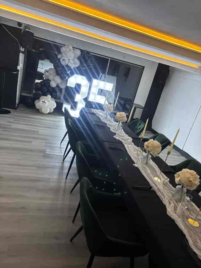 Private event space at No.22 Kitchen & Bar with marquee 35 signage for milestone celebrations.