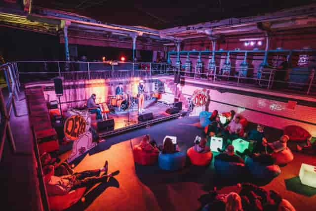 The Females Pool at Victoria Baths: industrial experiential event venue with sunken performance area.