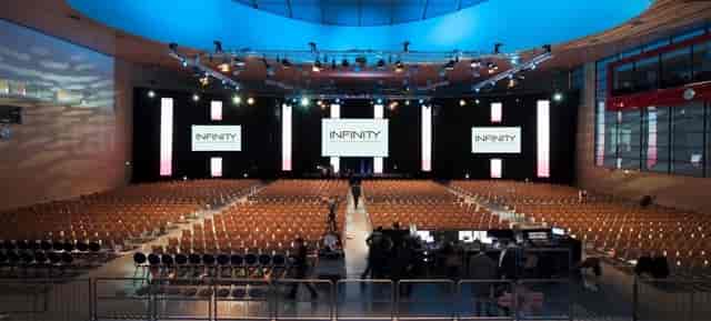 Ballhausforum plenary stage with theater seating for corporate events and professional conferences.