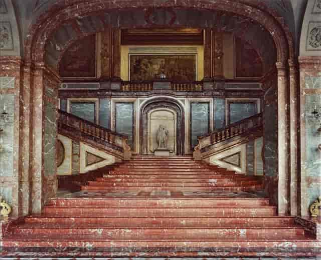 Coudenberg Palace conference center stairs for dramatic gala event planning and VIP red carpets.
