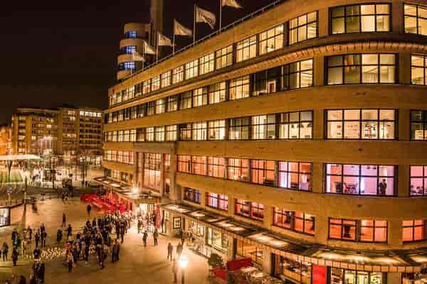 Bustling Cinema Flagey event venue with vibrant architectural lighting for corporate gala nights.