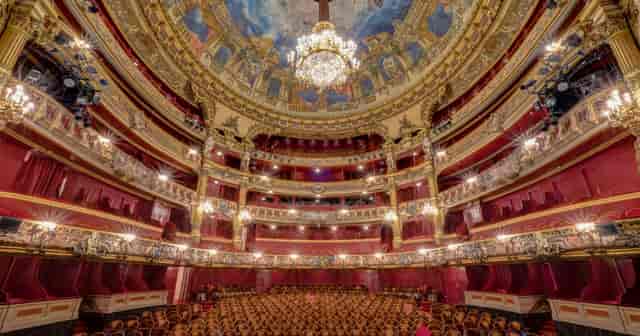 Tiered La Monnaie auditorium for prestigious keynote presentations and gala awards.