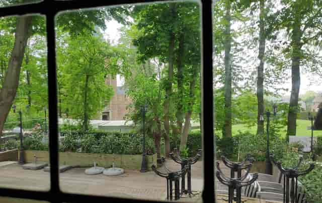 Outdoor terrace venue with historic backdrop for garden reception event space.