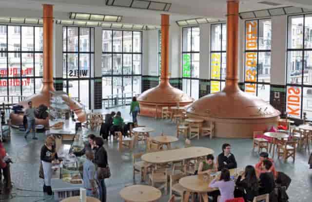 The Brewing Hall at WIELS: industrial venue with copper vats for corporate events and networking.