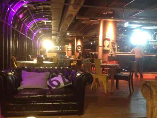 Industrial-chic hotel bar in Brussels, perfect for networking mixers and corporate social events.