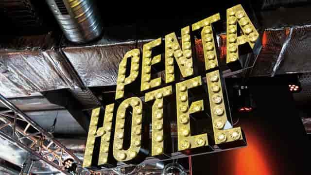 Industrial-chic convention center with marquee signage for corporate events and brand activations.