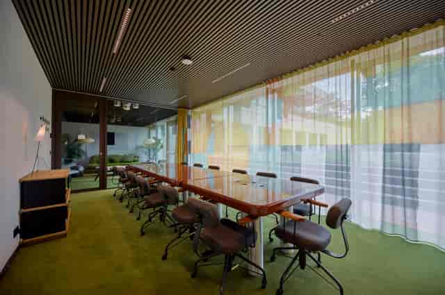 Luxury boardroom with lounge for executive strategy sessions and corporate meetings.