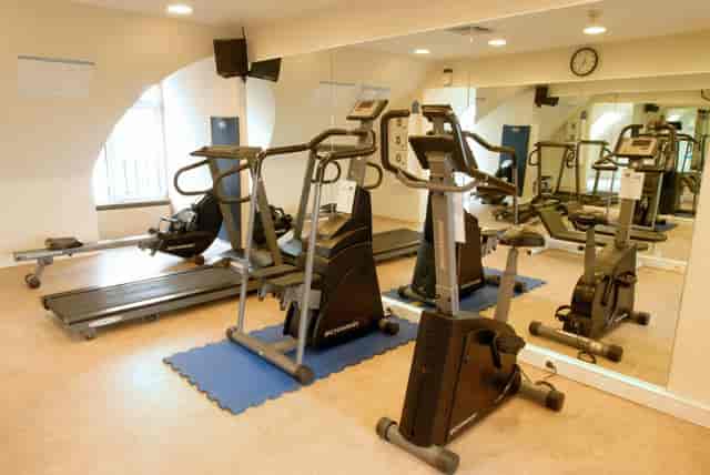 Compact hotel fitness center at Martin's Brussels EU for business travel wellness.