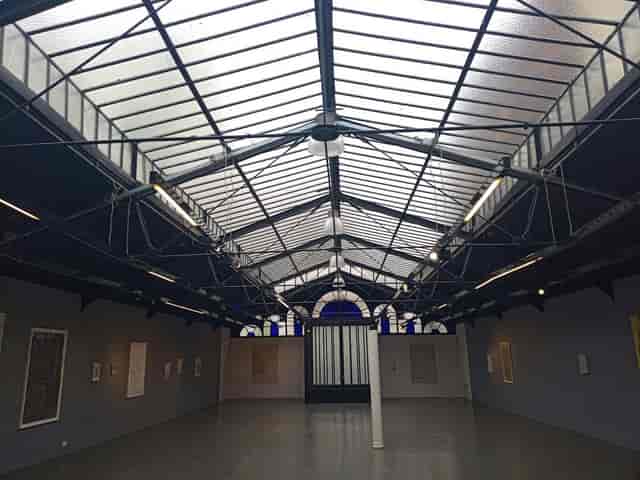 Glass roof at Galerie La Patinoire Royale Bach, industrial event venue for product launches.