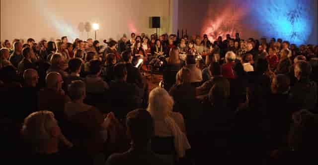 Immersive circular lounge performance setup for intimate corporate event or product launch.