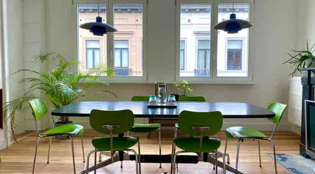 Intimate boardroom at Full Circle with natural light, ideal for professional meetings and events.