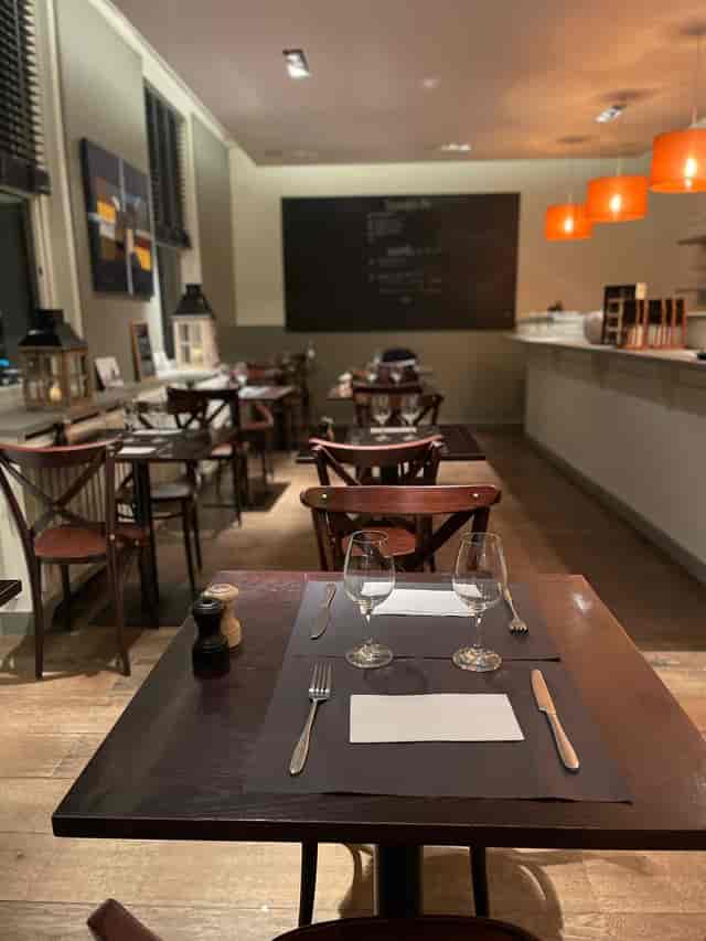 Intimate restaurant board room setup for professional business dinners and corporate networking.