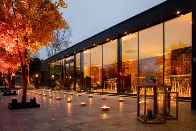 Luxury West-tent venue, atmospheric floor lighting, evening reception and cocktail hour event.