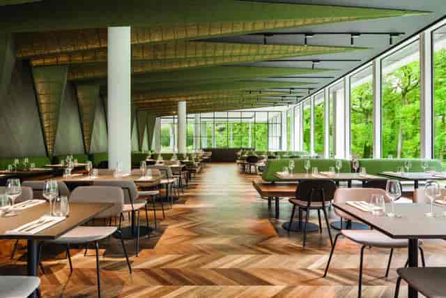 Modern corporate event space with biophilic design for business networking and conferences.