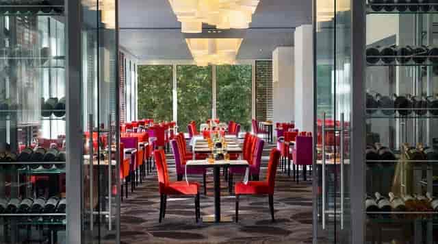 Brasserie 135: Sophisticated dining space with wine storage for corporate luncheons and receptions.